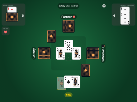 Euchre on an iPad held sideways: the score for each team in the top corners, the three other players' face-down hands around the green felt, a trick being played over Taco printed faintly in the middle with each team's won tricks on a corner, and the player's cards along the bottom.